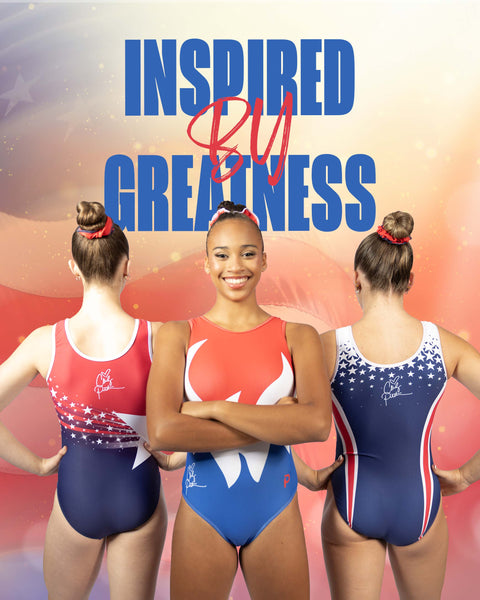 Two young gymnasts modeling matching red, white, and blue sleeveless leotards in a sports arena.