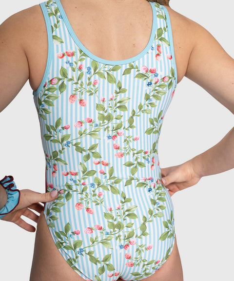 Close-up of blue stripe detail and berry floral print on Berry Bliss gymnastics leotard.