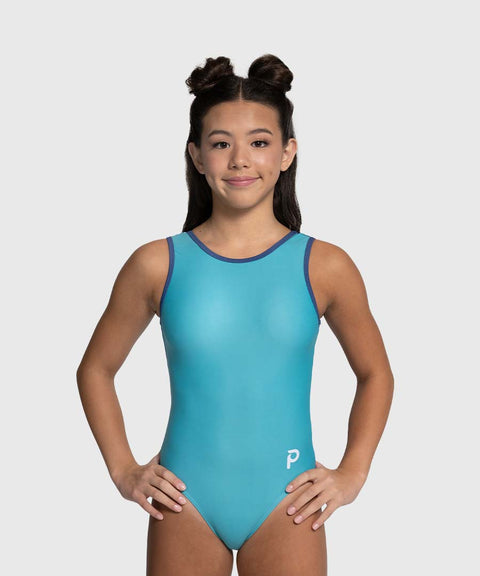 Girl wearing a blue leotard with a white logo on a gray background