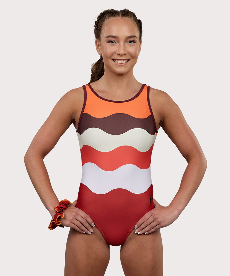 Plum Fawn Keyhole Gymnastics Leotard for Girls in orange, copper, brown, and white. Girls Gymnastics Leotard with wavy design.