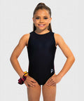 Girls gymnastics leotard with sleek black front and fiery orange-to-yellow ombré back. Flip Side design.