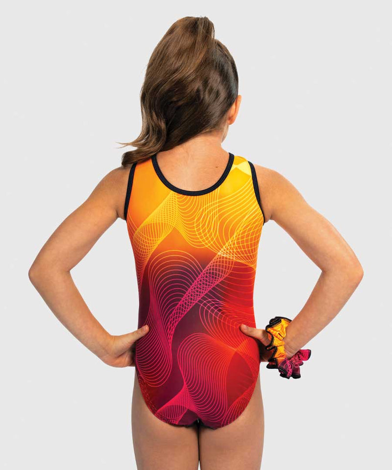 Girls gymnastics leotard with sleek black front and fiery orange-to-yellow ombré back. Flip Side design.