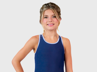 The Plum Cares Frozen Waves Racerback Leotard with vibrant blue wave patterns and white accent racerback inspired by the Arctic Ocean. 