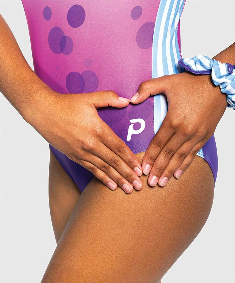 Plum Love - Girls gymnastics leotard with purple-to-pink ombré bubble print and bold stripe side panels.