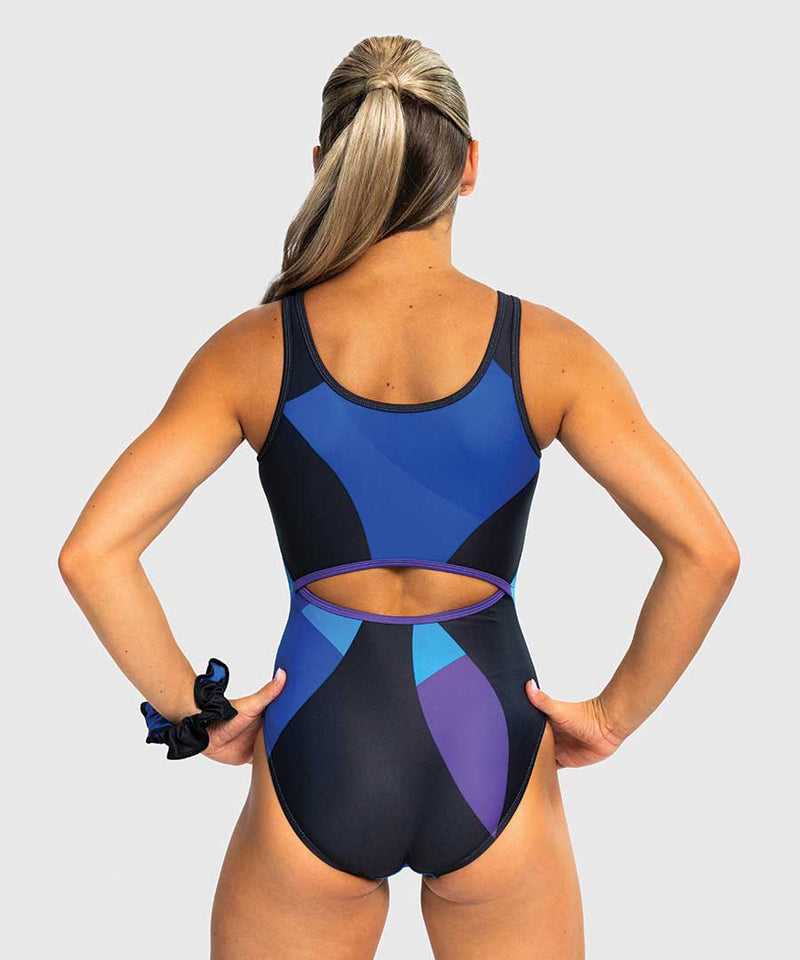 Girls gymnastics leotard in black, blue, and purple with keyhole back, inspired by mirror and juggling motion.