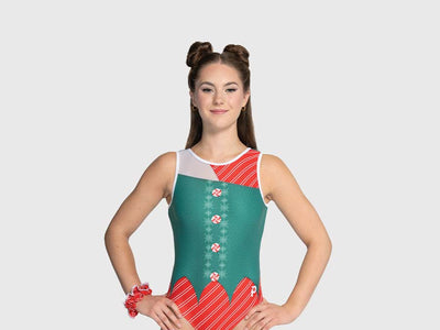 Front of girls gymnastics leotard with candy cane stripe body, green vest overlay, and sheer mesh cutouts.