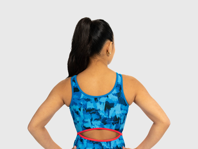 Sunset-toned girls leotard with keyhole open back. Great for long torsos and summer training.