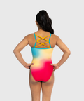 Girls coral shimmer leotard with criss-cross straps. Bold and radiant gymnastics tank.