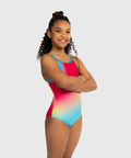 Girls coral shimmer leotard with criss-cross straps. Bold and radiant gymnastics tank.