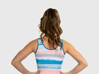 Girls gymnastics leotard with bold blue front and pastel stripe back. Flip Side tank style.