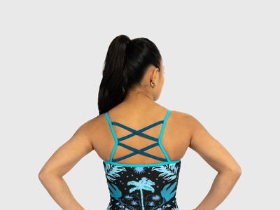 Floral gymnastics leotard for girls with teal strappy criss-cross back. Soft and bold design.