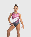 Gymnast posing in the Plum Hyper Drive pink, white, and charcoal tank gymnastics leotard