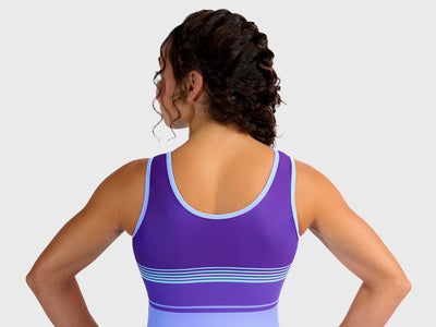 Plum Snowdrift Leotard featuring purple and blue stripes in a sporty tank design. Made for young gymnasts with smooth seams and a matching scrunchie. 