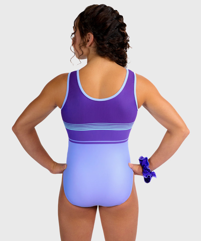 Plum Snowdrift Leotard featuring purple and blue stripes in a sporty tank design. Made for young gymnasts with smooth seams and a matching scrunchie. 