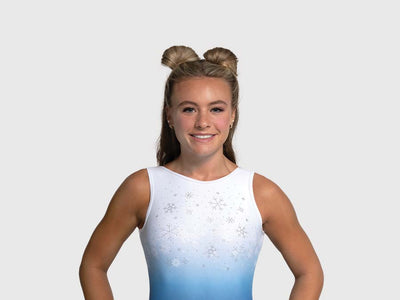Girls gymnastics leotard with blue to white ombré and crystal snowflake embellishments across the chest.