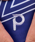 Gymnast wearing the Plum Stellar Mesh Top Leotard with a navy and white star design and breathable mesh panel.