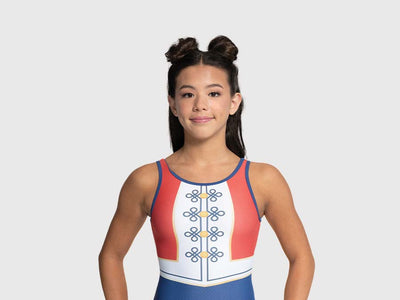 Girls gymnastics leotard with deep blue bottom, red and white vest-inspired top, and gold button accents.