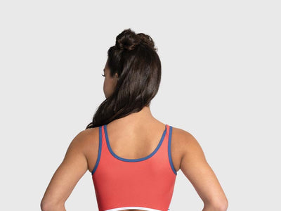 Back of Nutcracker-themed holiday leotard with red and white trim and secure tank silhouette.