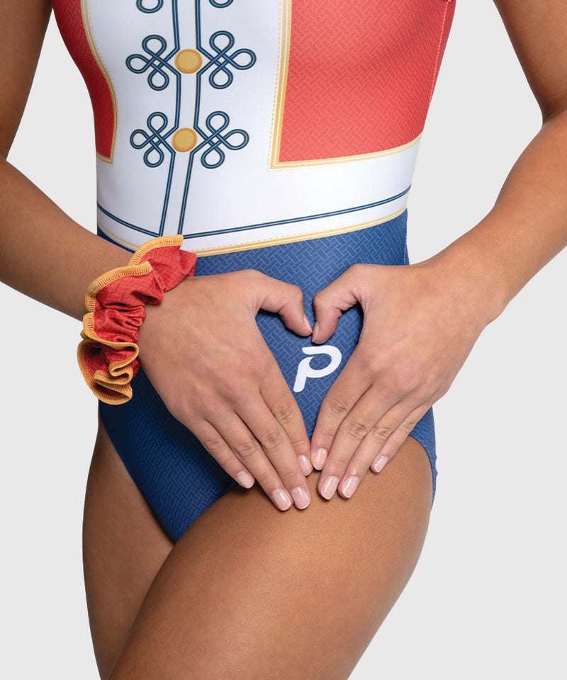 Close-up detail of Nutcracker-themed holiday girls gymnastics leotard